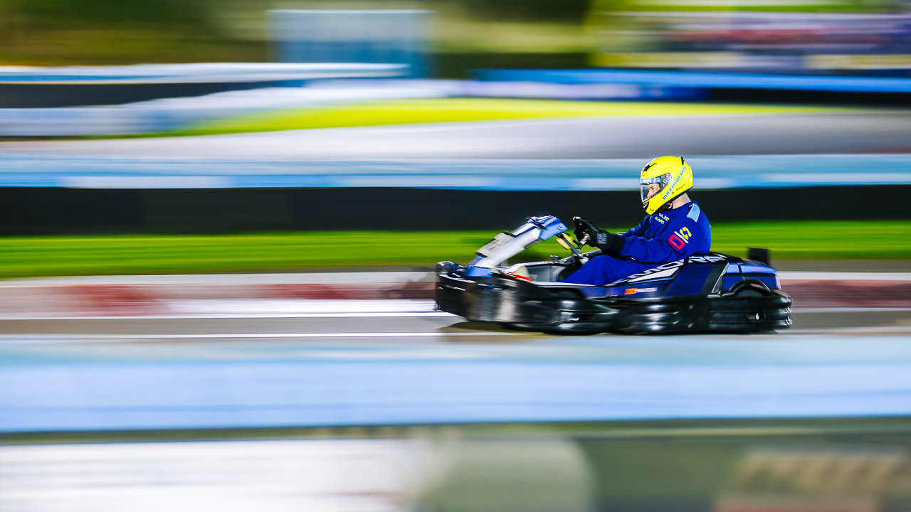 A kart driving around Buckmore Park during the night